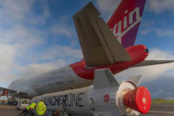 In this undated photo provided by Virgin Orbit on Monday, Jan. 9, 2023, Virgin Atlantic Cosmic Girl, a repurposed Virgin Atlantic Boeing 747 aircraft that will carry a rocket, is parked at Spaceport Cornwall, at Cornwall Airport in Newquay, England. Engineers are making final preparations for the first satellite launch from the U.K. later Monday, when a repurposed passenger plane is expected to release a Virgin Orbit rocket carrying several small satellites into space.