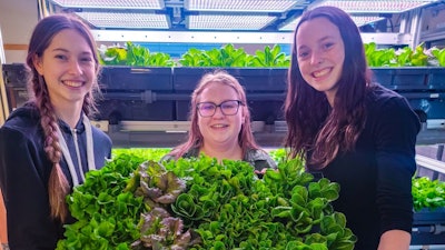 Student technicians Desiree Veeser, Presley Kasten and Lilly Franzen harvesting food direct to the cafeteria.