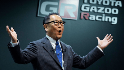 Toyota Motor Corp. Chief Executive Akio Toyoda delivers a speech on the stage at the Tokyo Auto Salon, an industry event similar to the world's auto shows Friday, Jan. 13, 2023, in Chiba near Tokyo.