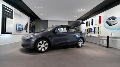 A Tesla Model Y Long Range is displayed on Feb. 24, 2021, at the Tesla Gallery in Troy, Mich.