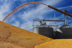 In this Sept. 23, 2015 file, photo, Central Illinois farmers deposit harvested corn on the ground outside a full grain elevator in Virginia, Ill.