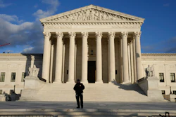 Security stands outside the U.S. Supreme Court, Jan. 20, 2023, in Washington.