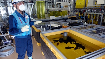 Noboru Ishizawa, a Tokyo Electric Power Company Holdings (TEPCO) official, speaks during an interview with The Associated Press at the Fukushima Daiichi nuclear power plant in Okuma town, northeastern Japan, on Feb. 22, 2023.