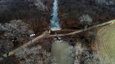 In this photo taken by a drone, cleanup continues in the area where the ruptured Keystone pipeline dumped oil into a creek in Washington County, Kan., Dec. 9, 2022.