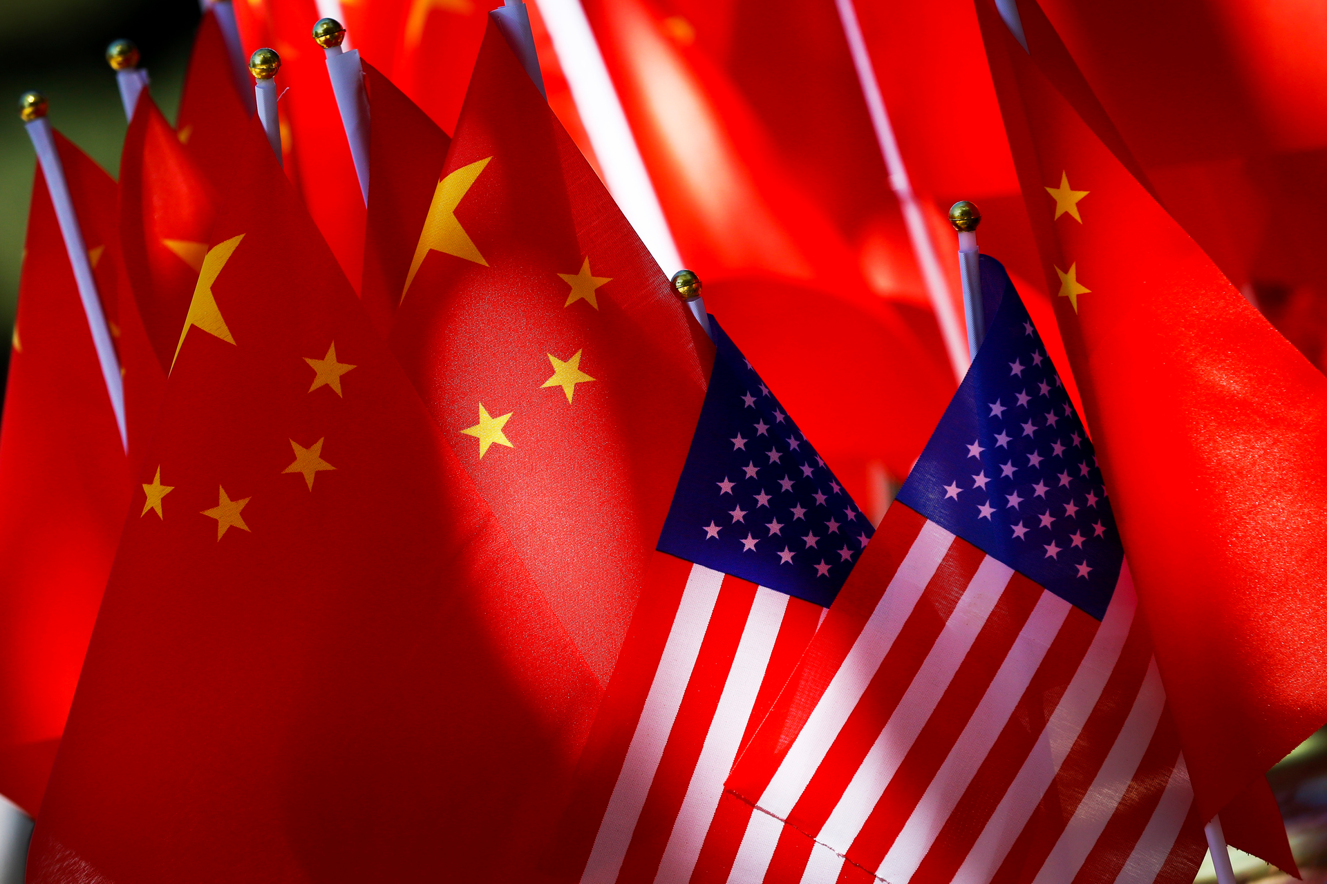 The flags of the U.S. and Chinese are displayed together on top of a trishaw in Beijing on Sept. 16, 2018.