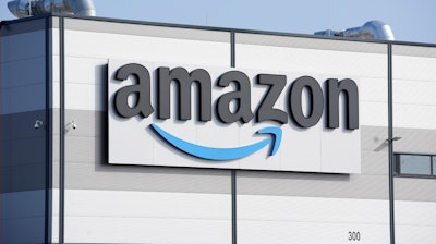 An Amazon company logo is seen on the facade of a company's building in Schoenefeld near Berlin, Germany, on March 18, 2022.