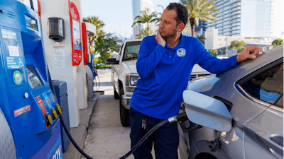 A driver puts fuel in his vehicle in Sunny Isles Beach, Fla., April 18, 2023.
