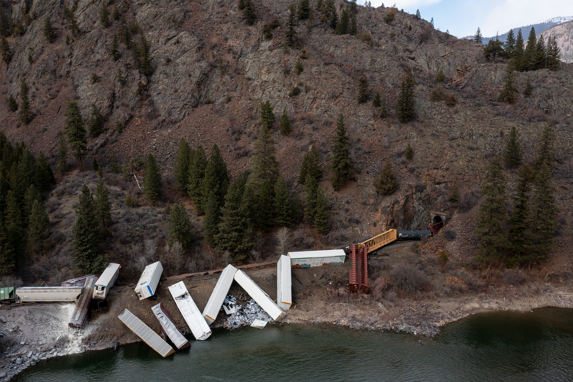 A train sits derailed near Quinn's Hot Springs Resort west of St. Regis, Mont., Sunday, April 2, 2023.