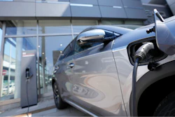 A BYD ATTO 3 electric sports utility vehicle gets charged as it is displayed at a BYD dealership on April 4, 2023, in Yokohama near Tokyo.