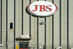 A worker heads into the JBS meatpacking plant in Greeley, Colo., Oct. 12, 2020.