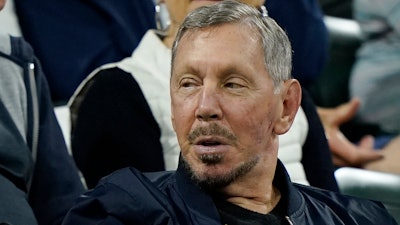 Larry Ellison, chairman of Oracle Corporation and chief technology officer, watches from the stands at the BNP Paribas Open tennis tournament Wednesday, Oct. 13, 2021, in Indian Wells, Calif.