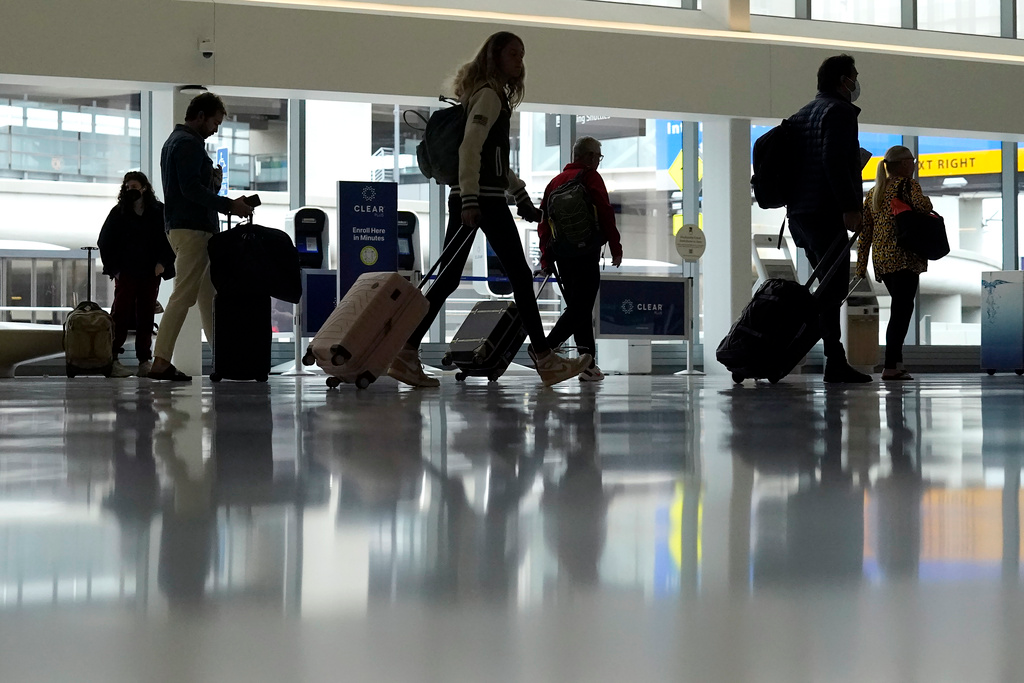 Travelers walk through a domestic terminal at San Francisco International Airport in San Francisco, Friday, May 26, 2023. On Wednesday, the Conference Board reports on U.S. consumer confidence for May.
