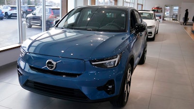 A 2023 Volvo C40 electric vehicle is displayed at a dealership, Tuesday, Feb. 7, 2023, in Exeter, N.H. Leasing is starting to look like the cheapest way to get an electric vehicle, because the U.S. government is giving it a big advantage. Dealers can apply up to the full $7,500 U.S. tax credit to leases of all electric vehicles regardless of where they're made.