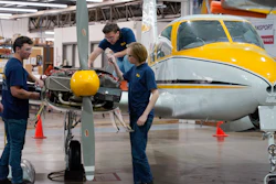 Students at the Pittsburgh Institute of Aeronautics from left: Nikki Reed, William Onderdonk, Jeffrey Natter and Joshua Lindberg study an engine on a Cessna 310 aircraft in West Mifflin, Pa., Tuesday, May 2, 2023.