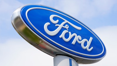 A Ford sign is shown at a dealership in Springfield, Pa., Tuesday, April 26, 2022.