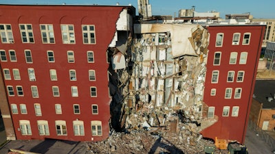 An apartment building that partially collapsed two days earlier can be seen Tuesday, May 30, 2023, in Davenport, Iowa.