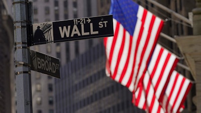 Flags fly outside the New York Stock Exchange, Sept. 23, 2022.