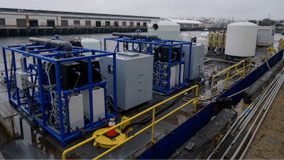 A demonstration site of a seawater-based carbon removal system is set up on a barge, Wednesday, April 12, 2023, in San Pedro, Calif.