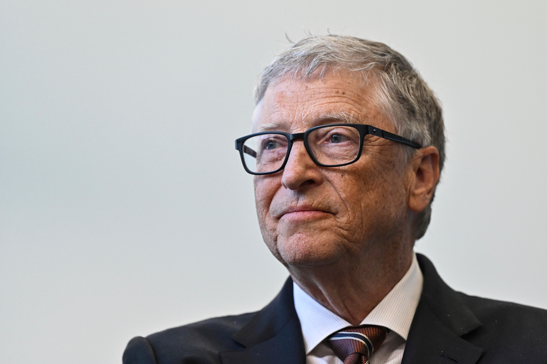 Bill Gates reacts during a visit with Britain's Prime Minister Rishi Sunak at the Imperial College University, in central London, on Feb. 15, 2023.