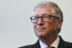 Bill Gates reacts during a visit with Britain's Prime Minister Rishi Sunak at the Imperial College University, in central London, on Feb. 15, 2023.