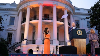 President Joe Biden, with first lady Jill Biden and director Eva Longoria, speaks before a screening of the film 'Flamin' Hot' on the South Lawn of the White House, June 15, 2023.
