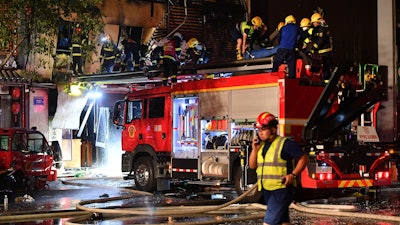Firefighters work at the site of an explosion at a restaurant in Yinchuan, China, June 21, 2023.