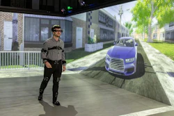 Participant interacting as a pedestrian in a driver-pedestrian simulator.
