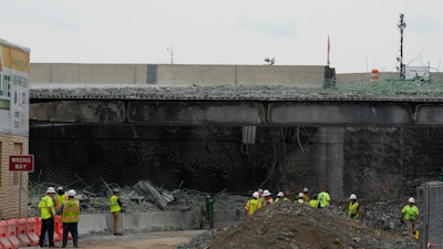 Crews work at the scene of a collapsed section of Interstate 95 in Philadelphia, June 14, 2023.