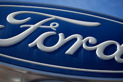 This Oct. 24, 2021 file photo shows a Ford company logo on a sign at a Ford dealership in southeast Denver.