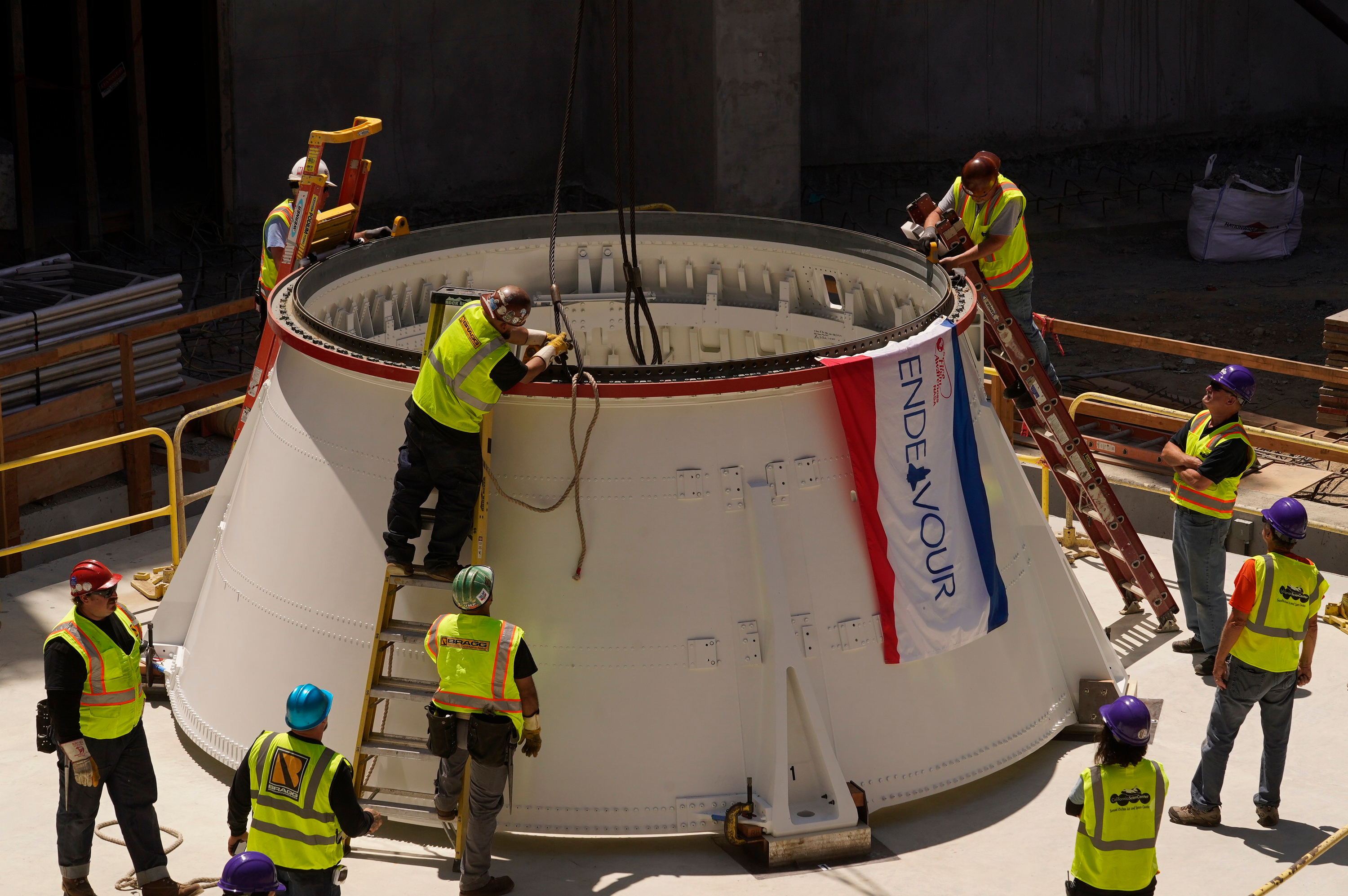 Space Shuttle Endeavour Finds New Home In 20 Story Tall Museum Display   AP23201791338845.64ba94f5f387d 