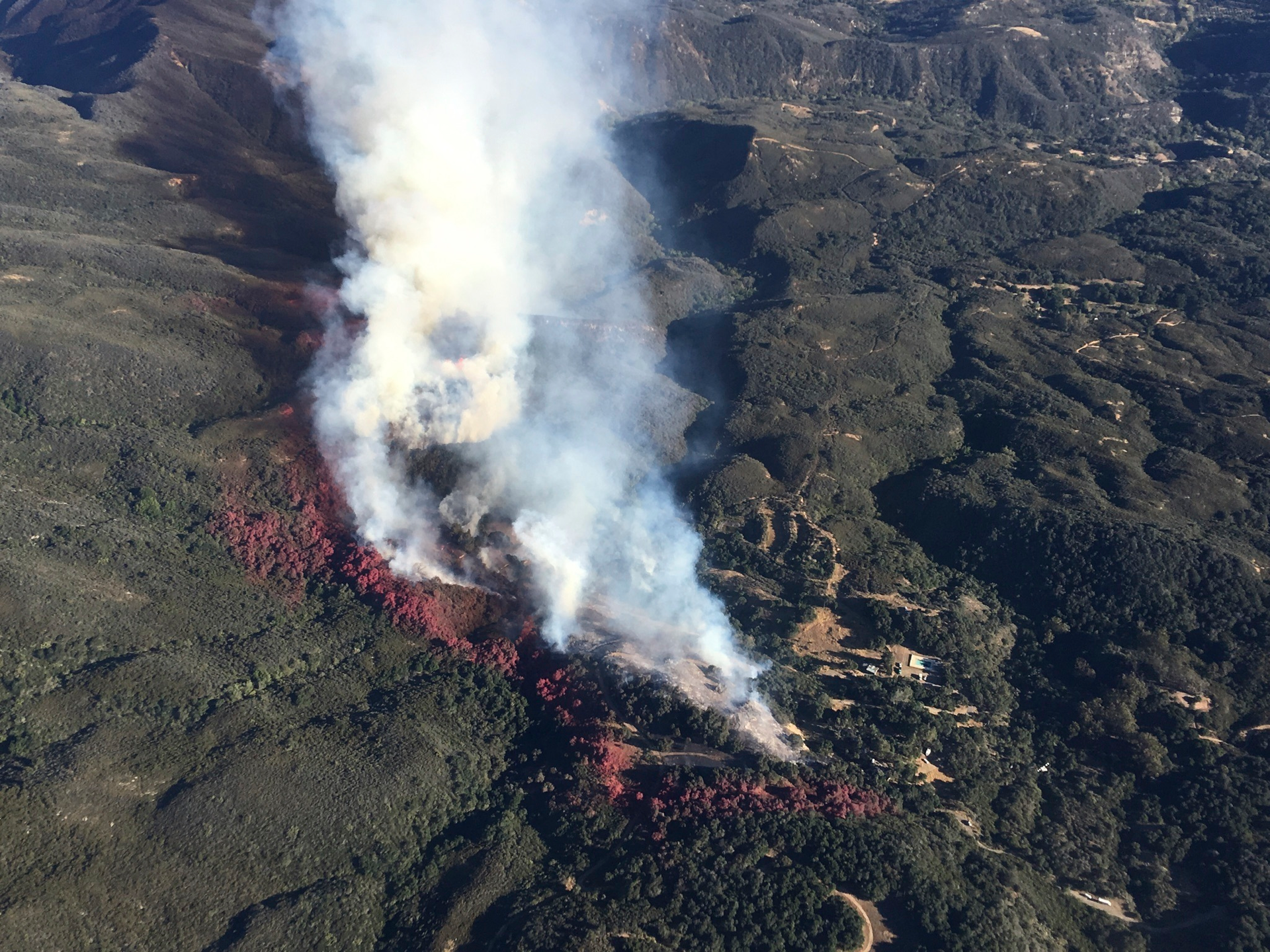 This photo provided by Los Padres Forest Aviation and KEYT-TV shows a wildfire burning in Los Padres National Forest, north of Santa Barbara, on Wednesday, June 15, 2016, in Goleta, Calif.