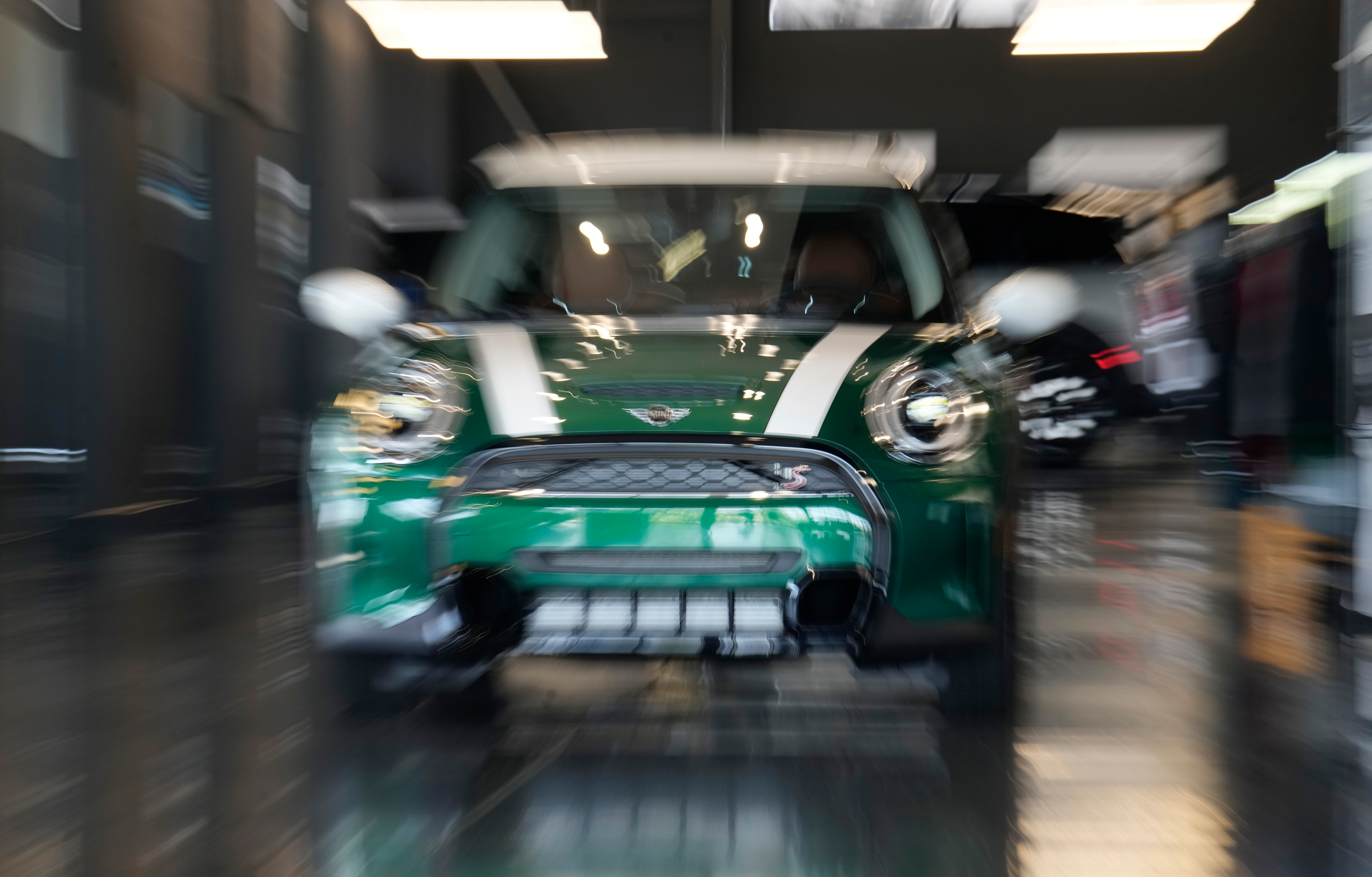 An unsold 2024 Cooper S hardtop sits in a Mini dealership Friday, July 21, 2023, in Highlands Ranch, Colo.