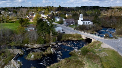 The Pleasant River flows through Columbia Falls, Maine, April 27, 2023.