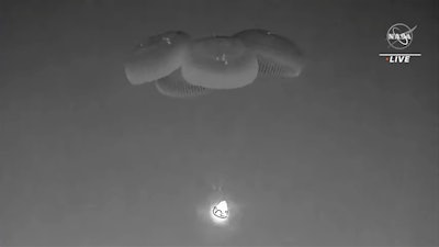 In this image from video made available by NASA, a SpaceX capsule, slowed by parachutes, approaches the surface of the Atlantic Ocean off the Florida coast, Monday, Sept. 4, 2023, as it returns to Earth with NASA astronaut Stephen Bowen, United Arab Emirates astronaut Sultan al-Neyadi, NASA astronaut Warren (Woody) Hoburg and Roscosmos cosmonaut Andrei Fedyaev after a six-month stay at the International Space Station.