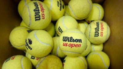 A box of game-used tennis balls rest in a shipping box during the U.S. Open tennis championships, Monday, Sept. 4, 2023, in New York.