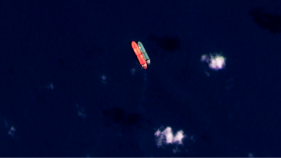 In this satellite photo provided by Planet Labs PBC, vessels identified as the Virgo, left, and the Suez Rajan, by the advocacy group United Against Nuclear Iran, are seen in the South China Sea on Feb. 13, 2022.
