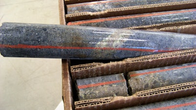 A core sample drilled from underground rock near Ely, Minn., shows a band of shiny minerals containing copper, nickel and precious metals, center, that Twin Metals Minnesota LLC, hopes to mine near the Boundary Waters Canoe Area Wilderness in northeastern Minnesota, Oct. 4, 2011.