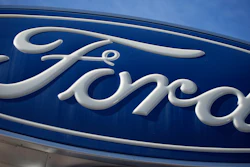 The Ford company logo is seen, Oct. 24, 2021, on a sign at a Ford dealership in southeast Denver. Ford is keeping it in the family.