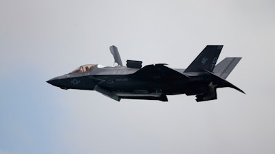 A United States Marine Corps F-35B Lightning II takes part in an aerial display during the Singapore Airshow 2022 at Changi Exhibition Centre in Singapore, Feb. 15, 2022.