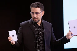 Microsoft's Chief Product Officer Panos Panay holds a Surface Duo, left, and Surface Neo at an event, Wednesday, Oct. 2, 2019, in New York.