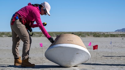 In this photo provided by NASA, recovery teams participate in field rehearsals to prepare for the retrieval of the sample return capsule from NASA's OSIRIS-REx mission at the Department of Defense's Utah Test and Training Range on Aug. 29, 2023.