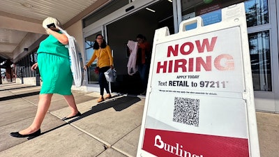 A hiring sign displayed at a retail store in Vernon Hills, Ill., Aug. 31, 2023.