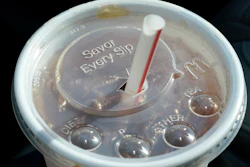 A McDonald's beverage sits in a cup holder, April 27, 2021, in Des Moines, Iowa. McDonald's plans to eliminate self-service soda machines at all of its U.S. restaurants by 2032, the Chicago-based fast food chain has confirmed. In an email to The Associated Press on Tuesday, Sept. 12, 2023, McDonald's USA said the goal of the change is to create consistency for customers and crew members across the chain's offerings — from in-person dining to online delivery and drive-thru options.
