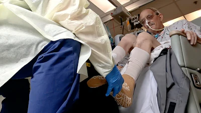 In this image from video provided by the University of Maryland School of Medicine, Lawrence Faucette, a pig heart transplant patient, works with a physical therapist at the school's hospital in Baltimore, Md., on Wednesday, Oct. 18, 2023.