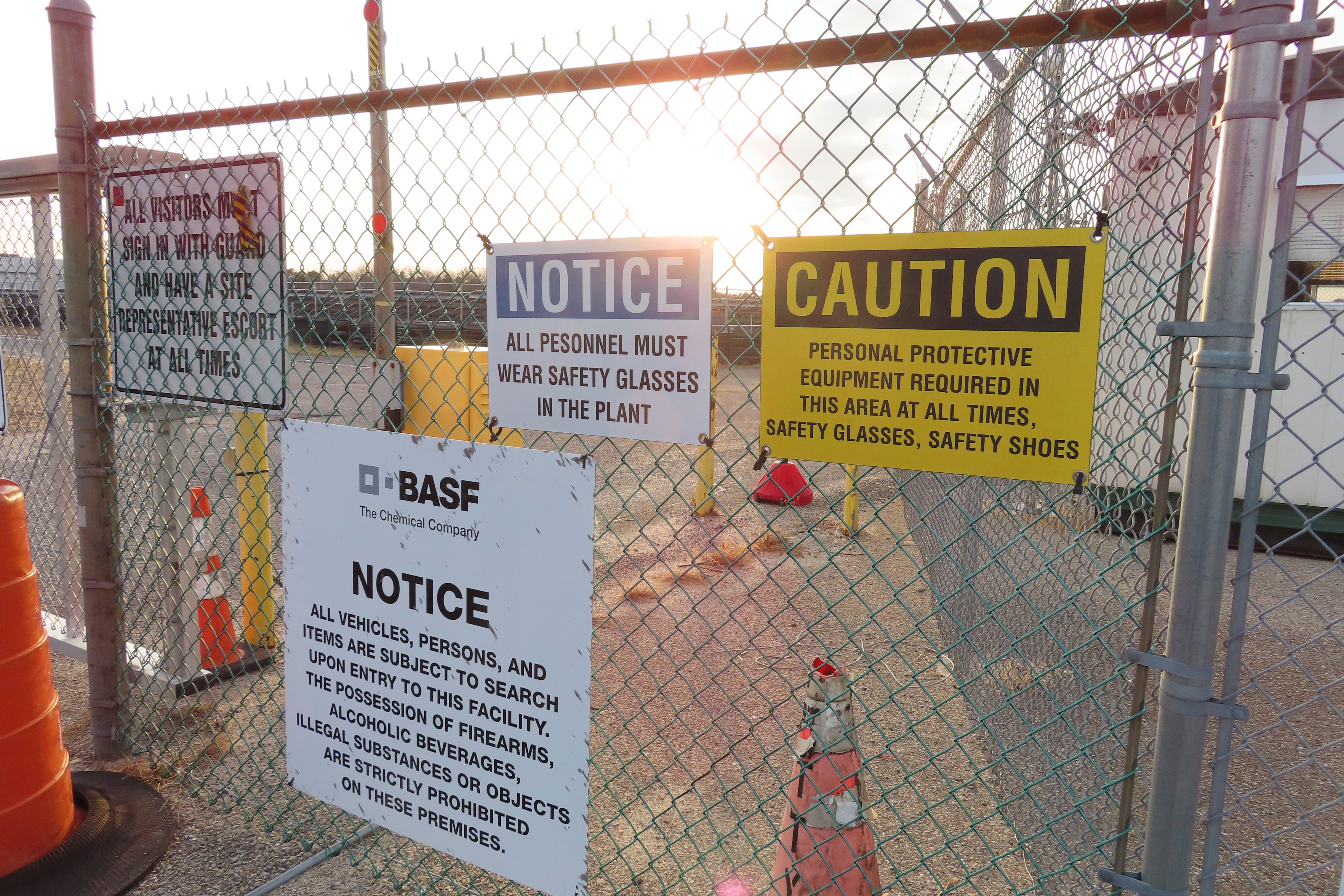 A gate at the entrance to the former Ciba Geigy chemical plant in Toms River, N.J. is posted with warning signs, Jan. 24, 2023, regarding the contaminated area, which is on the Superfund list of the nation's worst toxic waste sites.