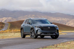 This photo provided by Mazda shows the 2024 CX-50. An upscale cabin and enjoyable performance back up this small SUV's stylish design.