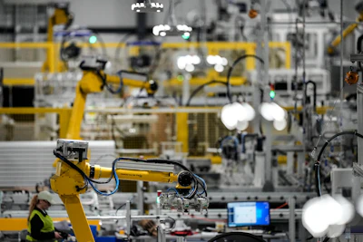 Articulated robots move inside the Hanwha Qcells Solar plant, Monday, Oct. 16, 2023, in Dalton, Ga. The Korean company is opening what it says is the first solar panel factory to begin production in the U.S. since the passage of President Joe Biden’s signature climate legislation.