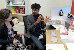 Post-doctoral researcher Tofunmi Omiye, right, gestures while talking in his office with assistant professor Roxana Daneshjou at the Stanford School of Medicine in Stanford, Calif., Tuesday, Oct. 17, 2023.