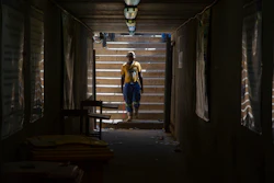 A miner walks at the entrance of a goldmine shaft in Springs, South Africa, Tuesday, Oct. 24, 2023.