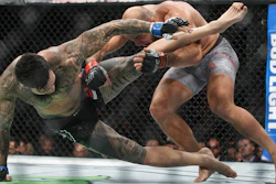 ILir Latifi, right, of Sweden, takes down Tyson Pedro, of Australia, during their bout at UFC 215, Edmonton, Alberta, Sept. 9, 2017.